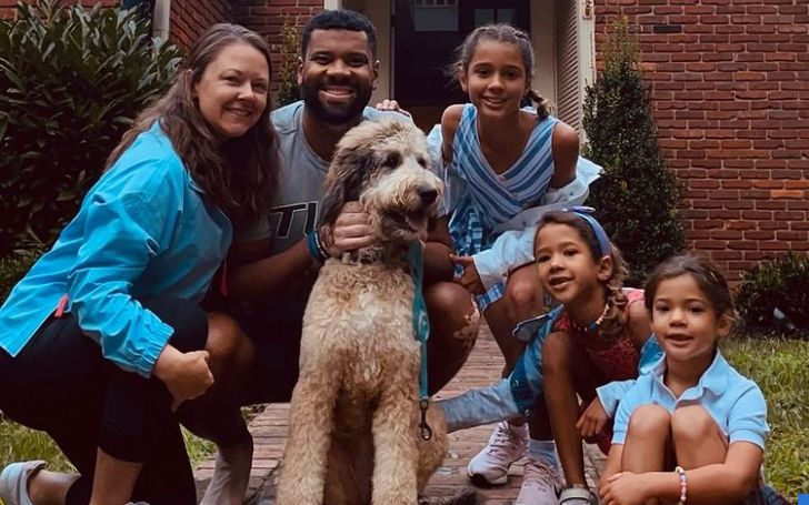 Harrison Wilson IV with his wife and three daughters.